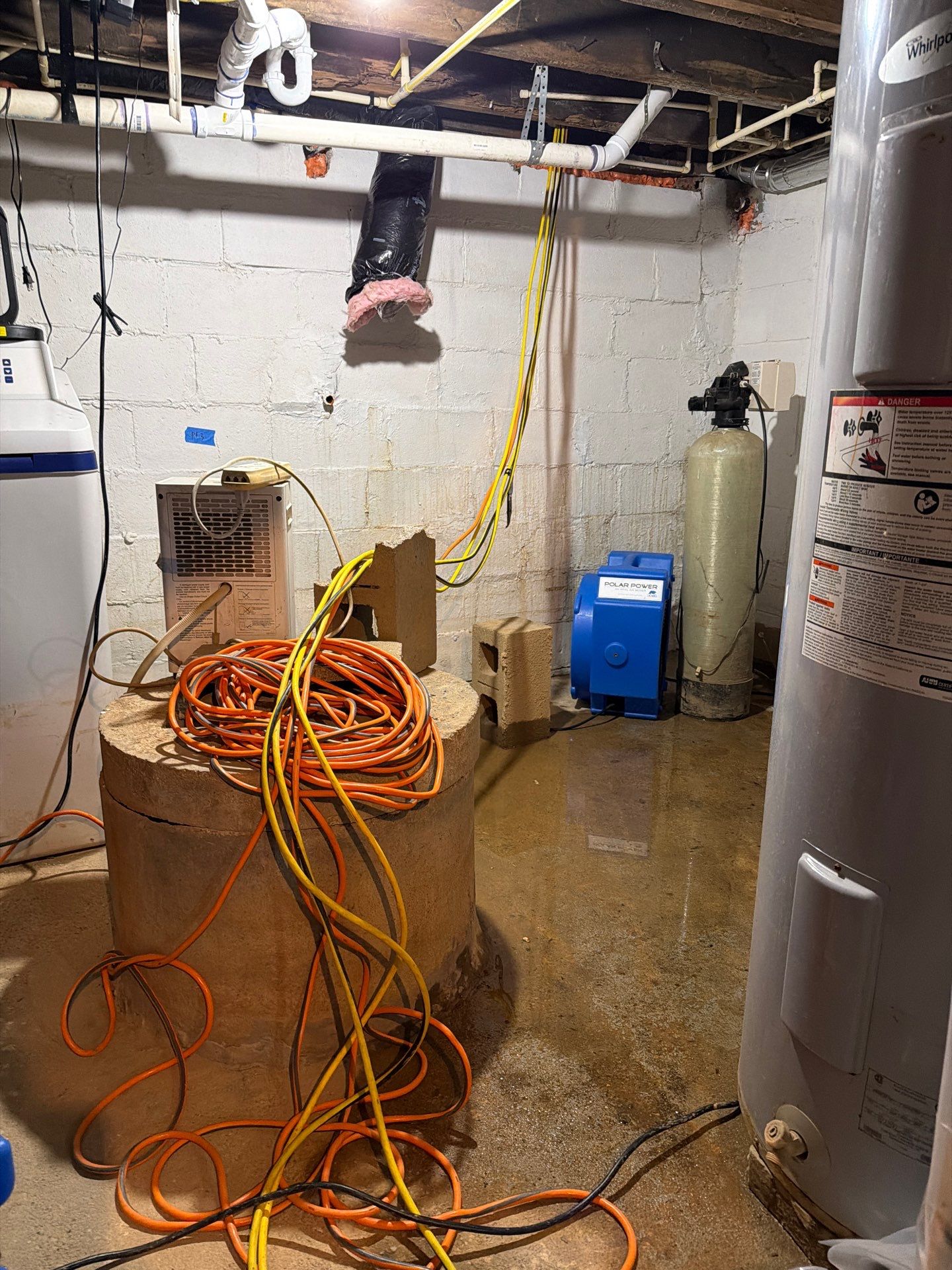 flooded basement with active flood
